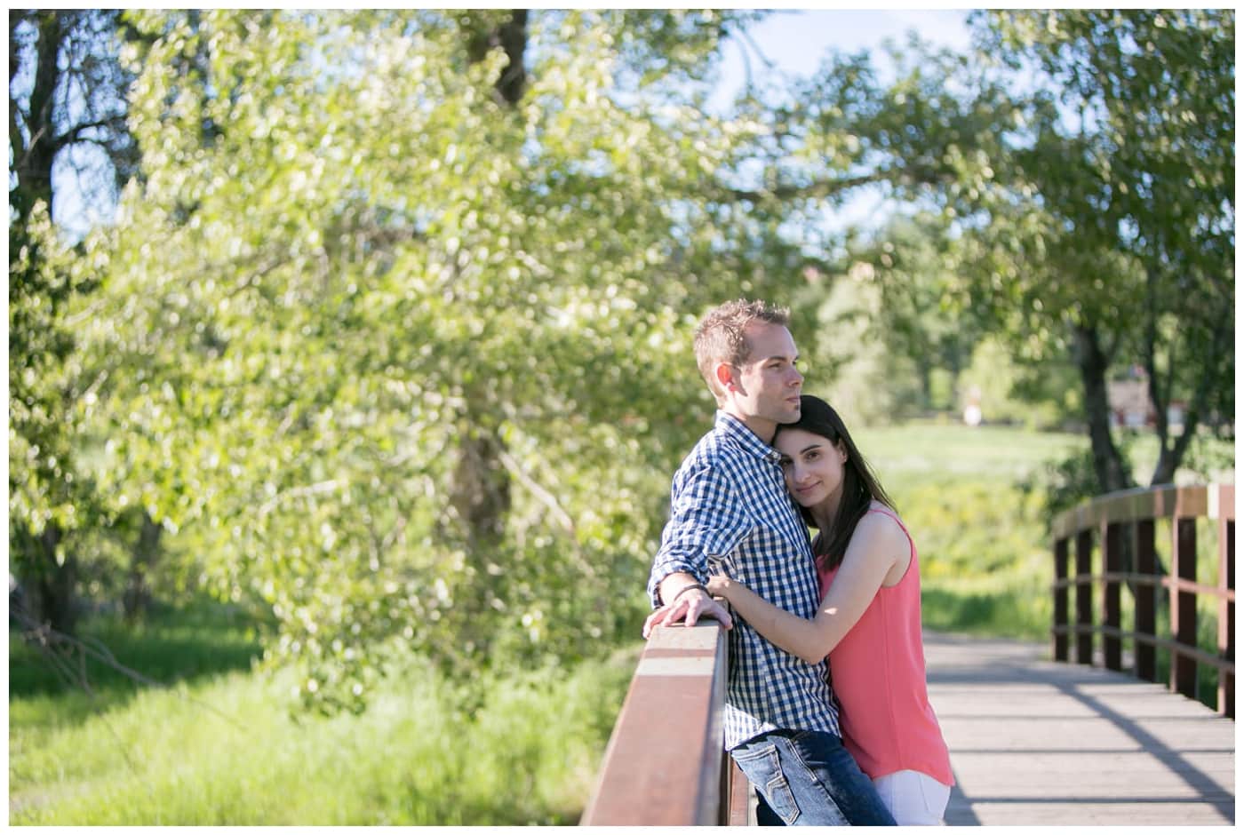 Fish Creek Park Engagement with a newly engaged couple and their dog, beautiful green trees, bridegs, and setting sunlight