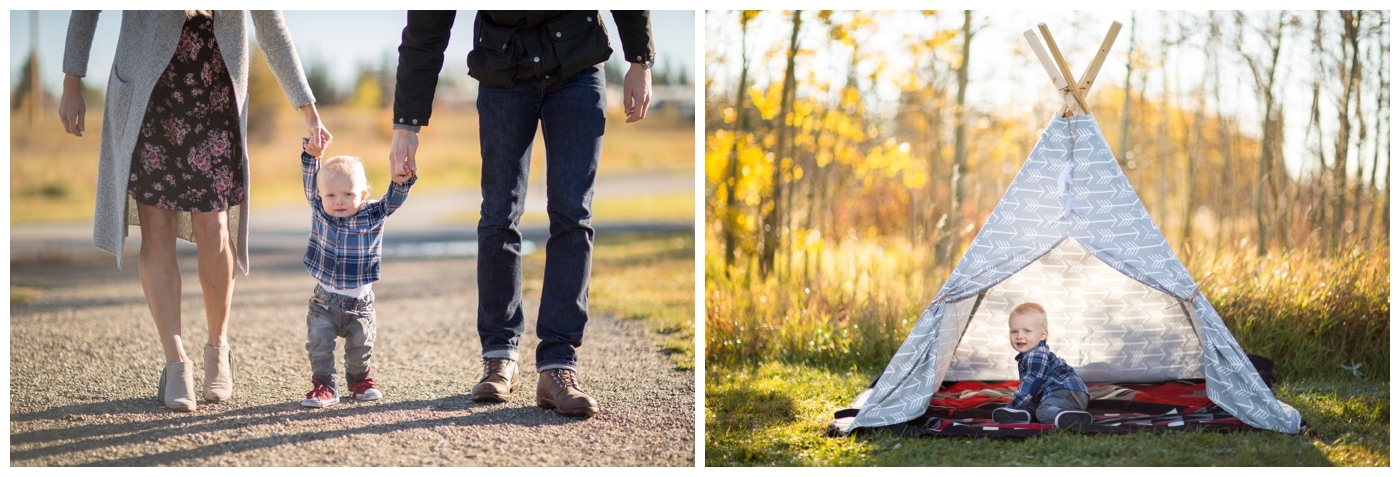 A little boy walks with the help of his mother's and father's hands, and then poses in a grey teepee