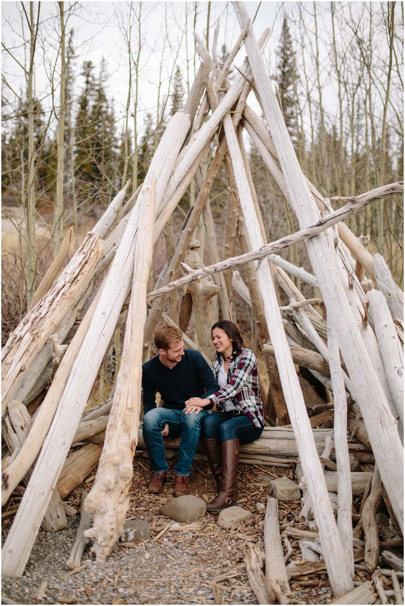 A beautiful adventure engagement session in the Rocky Mountains of Alberta at Barrier Lake, Kananaksis, and Spray Lakes with 360 mountain views and snow