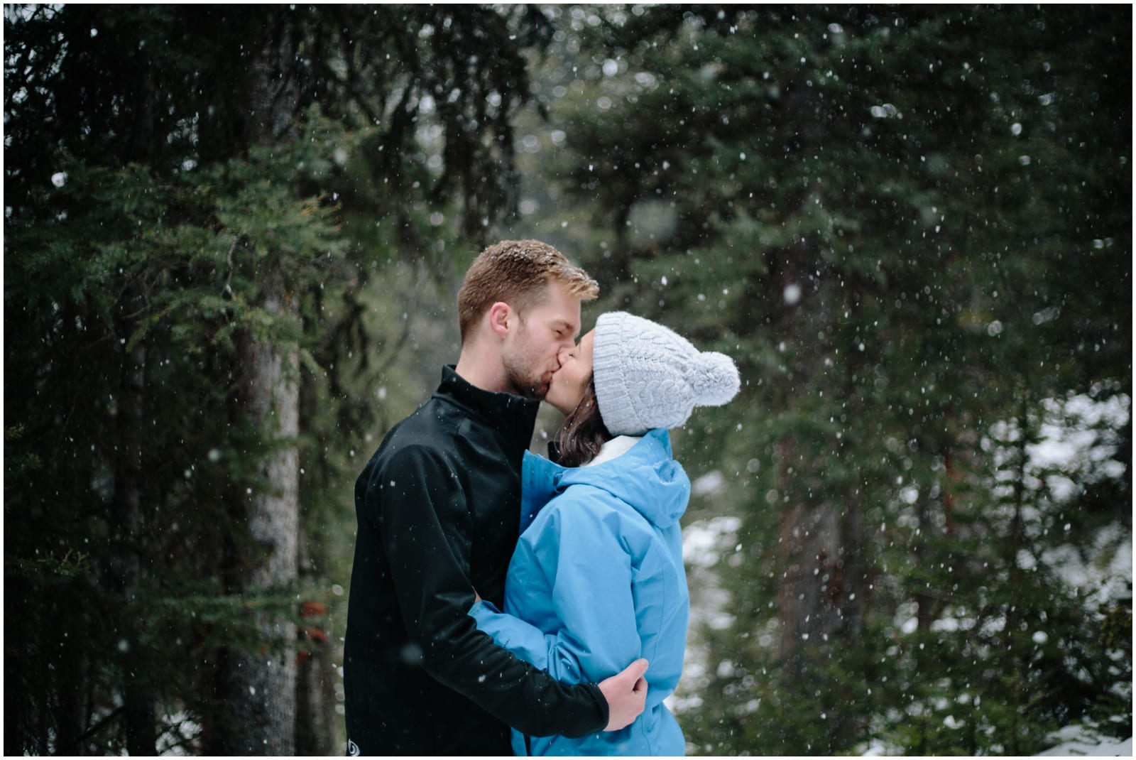 A beautiful adventure engagement session in the Rocky Mountains of Alberta at Barrier Lake, Kananaksis, and Spray Lakes with 360 mountain views and snow