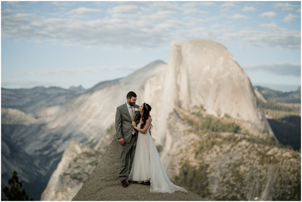 A newly wed couple embraces in Yosemite National Park