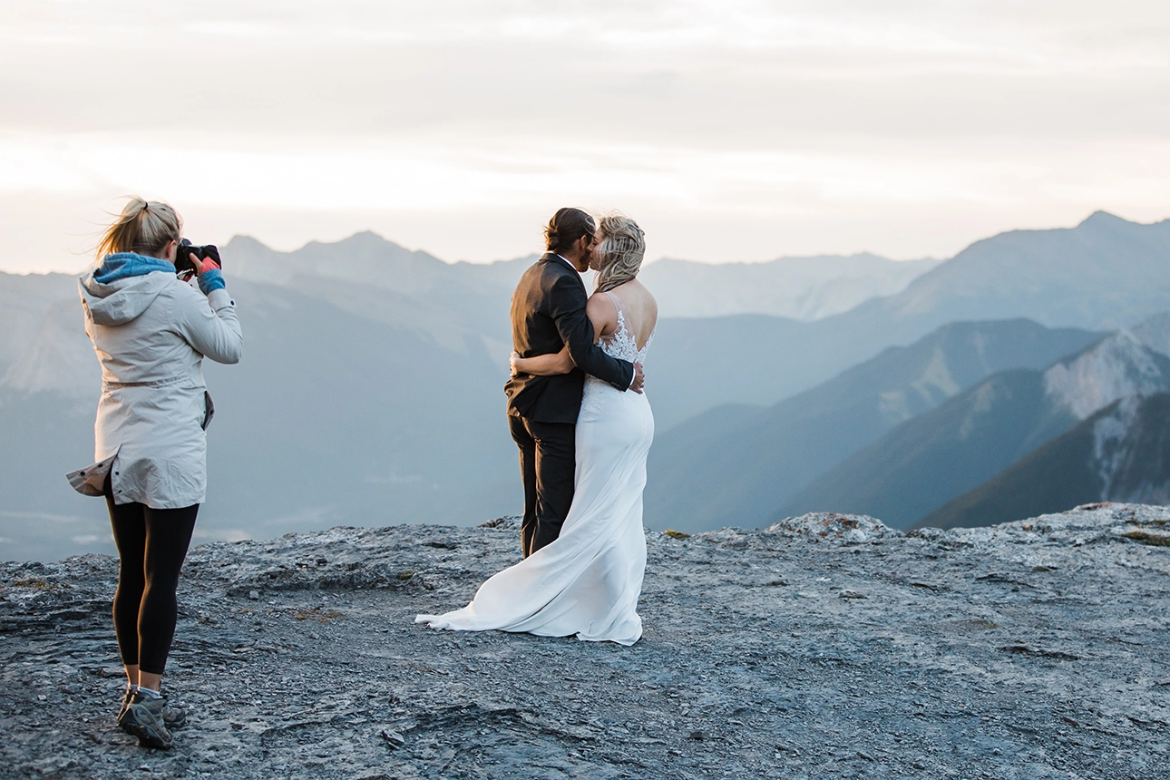 Banff Elopement Photographer captures an elopement couple on top of a mountain