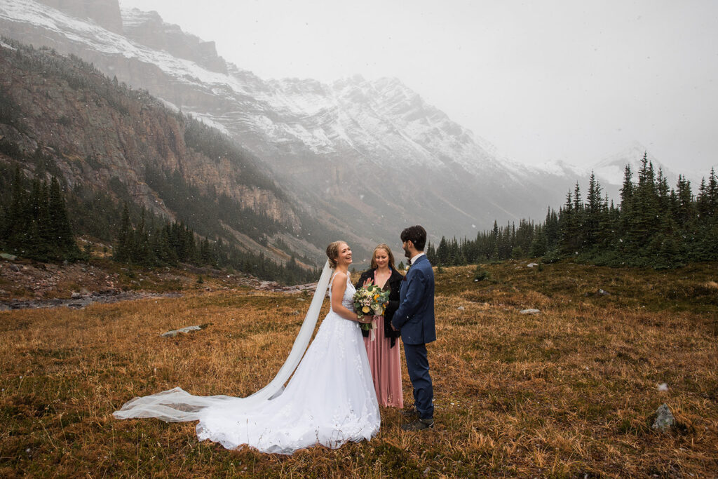 A snowy winter helicopter elopement in Banff surrounded by mountains