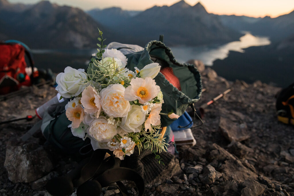 flowers in a hiking backpack for a hiking elopement in kananaskis