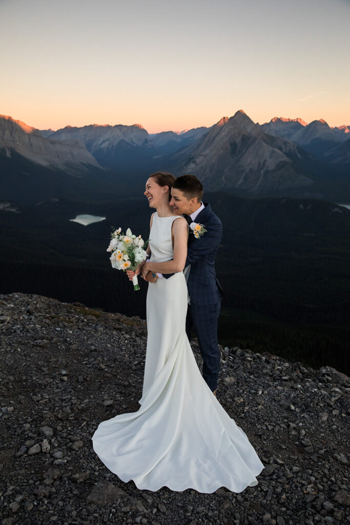 same sex couple elopes in banff at sunrise