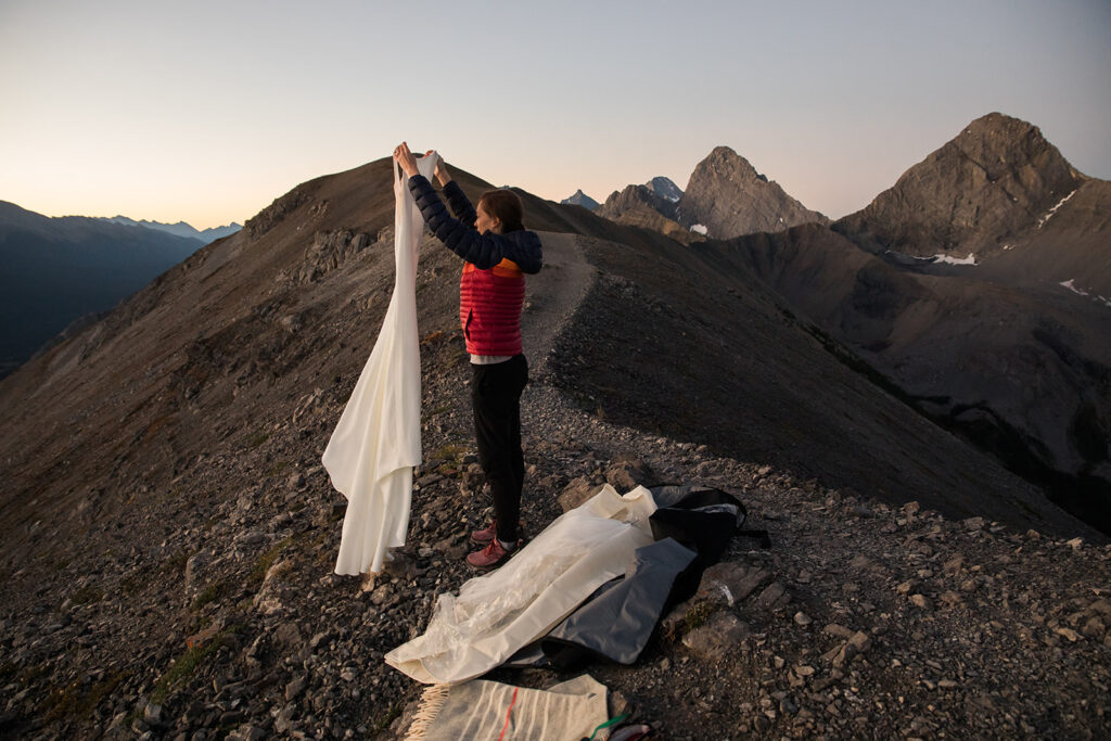 getting ready in the dark for a sunrise hiking elopement