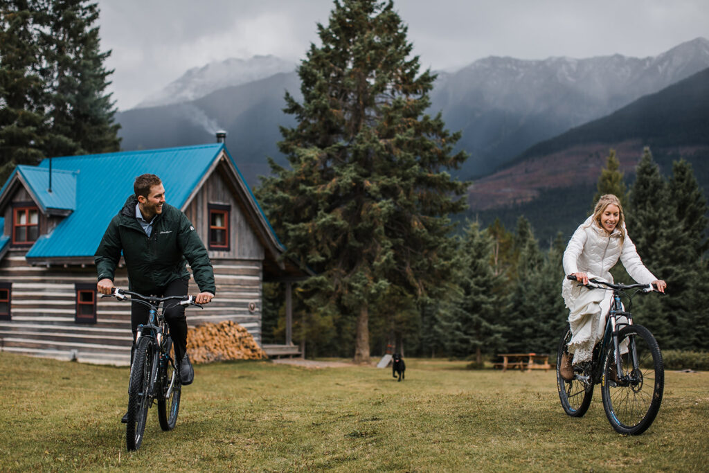 A couple mountain bikes in the mountains during their adventure elopement. 